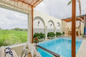 Luxury private swimming pool and outdoor lounge area of a Villa for sale in Tabanan.